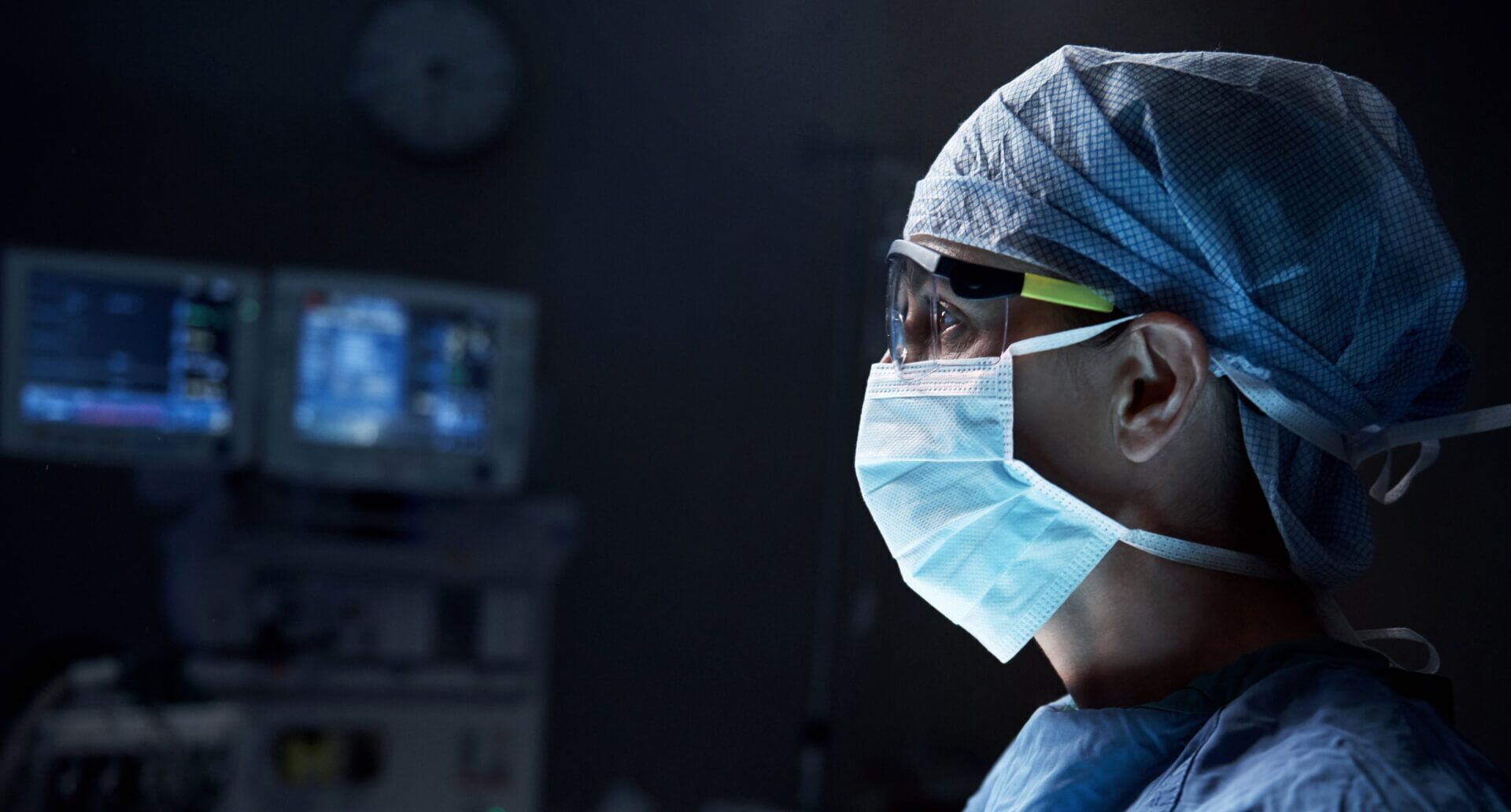 A doctor using Luma Vision observing a patient out of focus